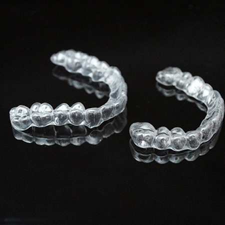 A set of clear aligners designed to straighten and realign a person’s smile